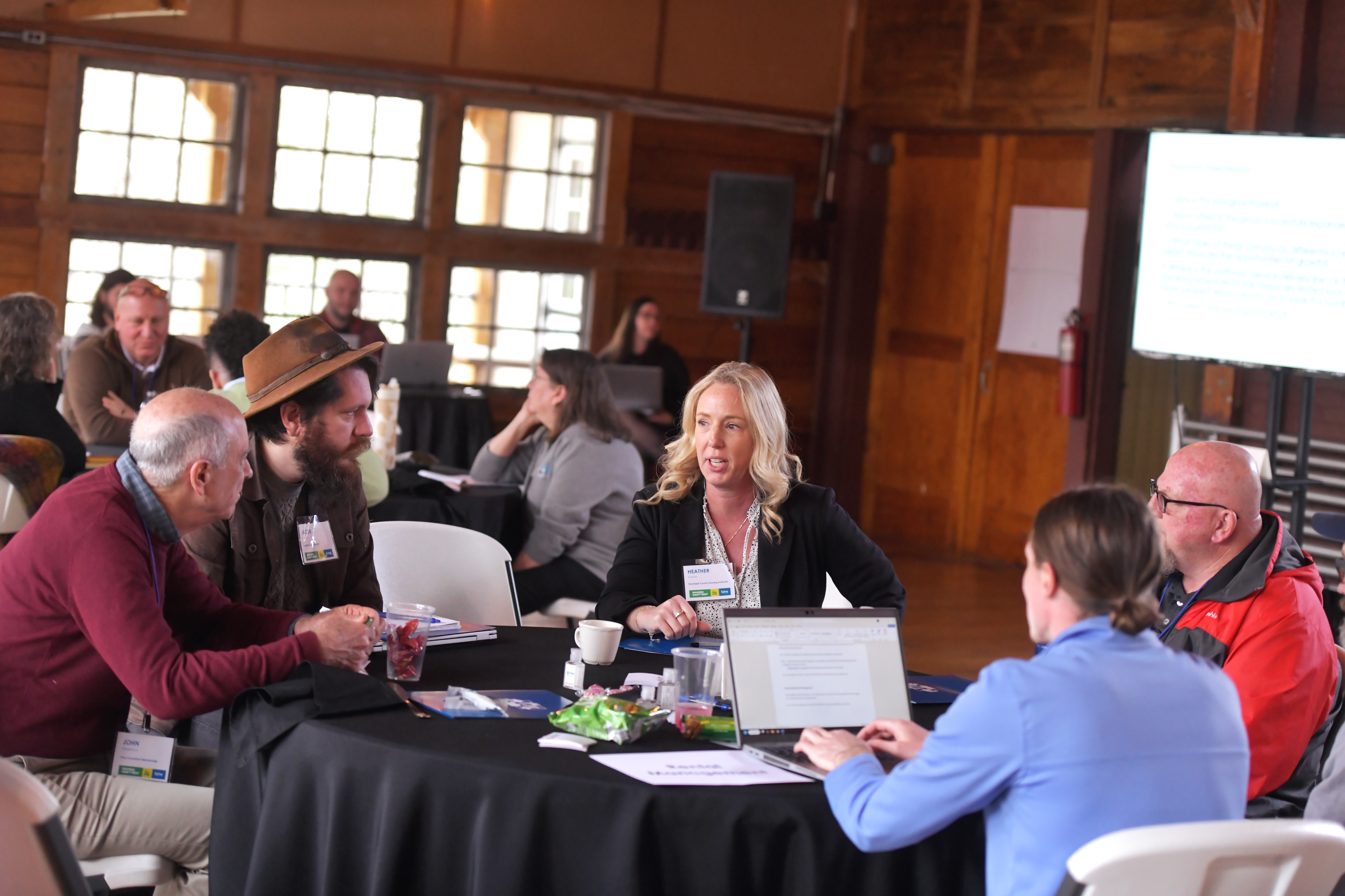 Group of people working together around a table.
