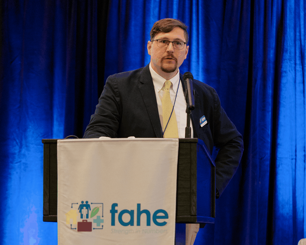 Joshua Stewart, Senior Director of Federal Policy Advocacy, presents a Federal Advocacy Update during the 2025 Fahe Annual Meeting in Kingsport, Tennessee, outlining national housing policy priorities for the Appalachian region.