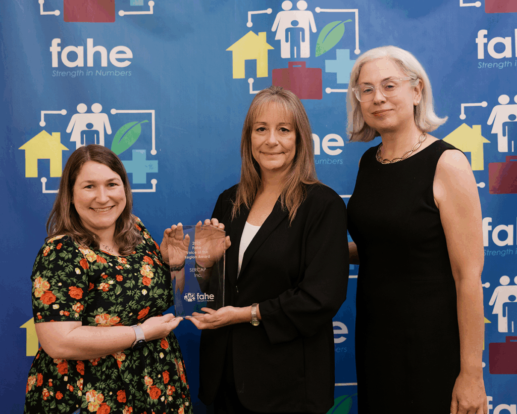 Ellen Smith and Cherry Wilson of SERCAP accept the 2025 Fahe Voice of the Region Award with Fahe Chief Communications Officer Lina Page at the Fahe Annual Meeting in Kingsport, Tennessee.