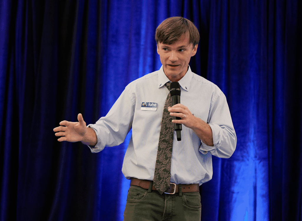 Traviss Witt, Fahe’s Advancement Director, leads the Bigger Impact Through Capacity and Creativity session at the 2025 Fahe Annual Meeting in Kingsport, Tennessee, highlighting innovative approaches to expand housing impact across Appalachia.